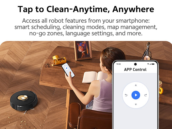 Person using a smartphone app to control a robot vacuum cleaner on a wooden floor.
