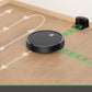 Robotic vacuum cleaner on a wooden floor with automatic recharging station.