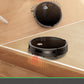 Robot vacuum cleaning a wooden floor with obstacle and dropping sensors highlighted.