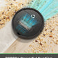 Robotic vacuum cleaner cleaning a floor with debris, highlighting powerful suction capability.