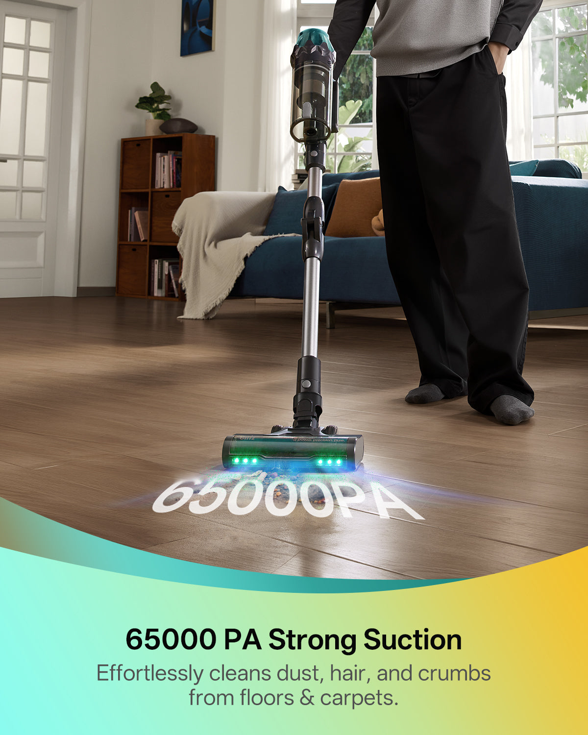 Person using a vacuum cleaner with 65000 PA suction in a living room.
