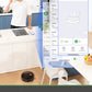 Person using a smart app on a smartphone in a kitchen with a robot vacuum cleaner.