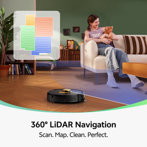 Robotic vacuum cleaner cleaning a living room with a woman sitting on a couch holding a teddy bear.
